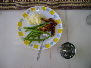 Chicken nuggets, mashed potatoes and beans