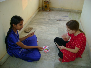 Freya and Monika (from across the road) playing UNO on the verandah